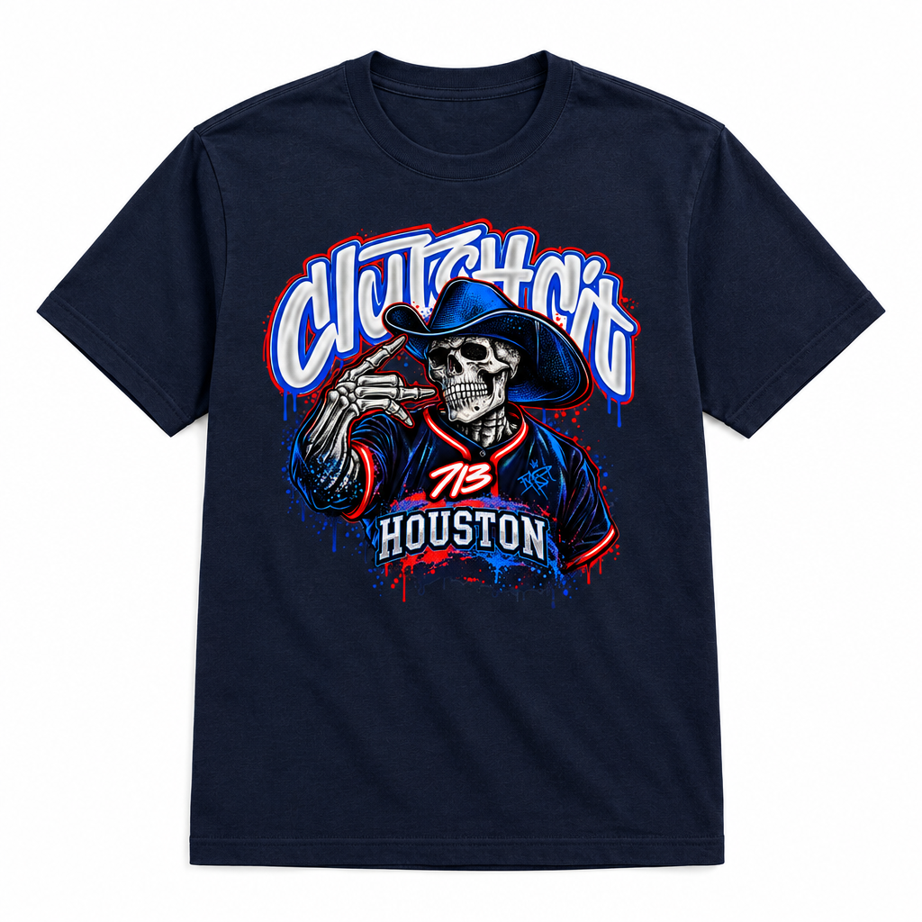 A navy blue short-sleeve t-shirt with a large graphic print on the front. The graphic features a cartoon skeleton wearing a cowboy hat and holding a cigar, with the words 'Clutch Hit' in a stylized white, blue, and red font above, and 'Houston' in a banner below with the number 73.